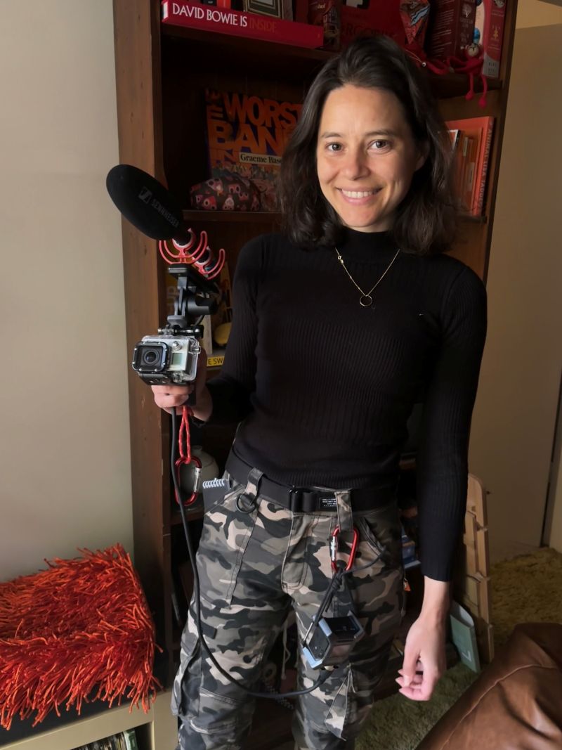Zoe Wilson holding camera with microphone