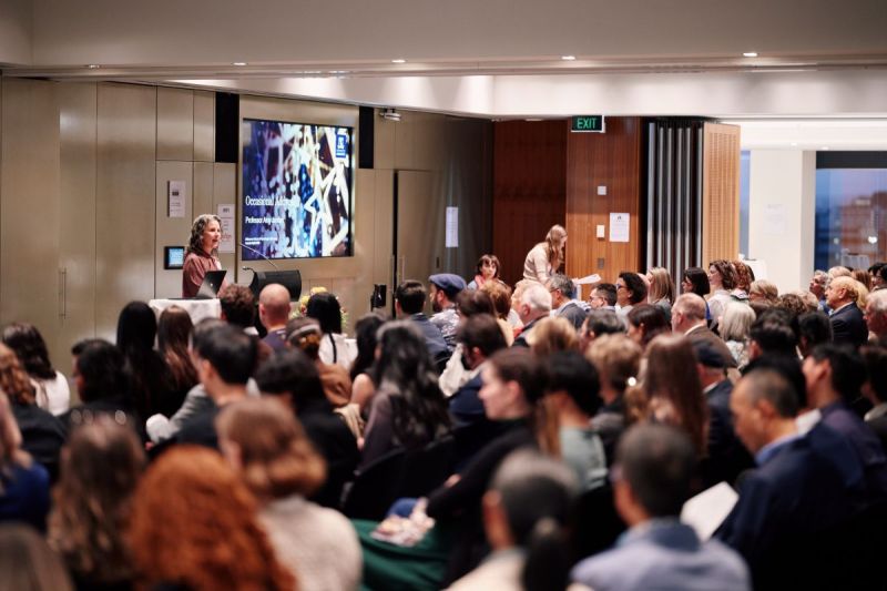 Professor Amy Jordan gives the Occasional Address in front of a full audience